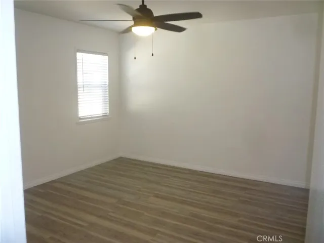 Bedroom #1 of two with ceiling fan and dual pane vinyl windows.