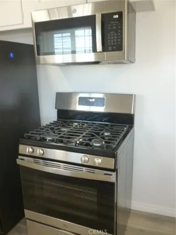 New GE gas range and microwave oven/hood.