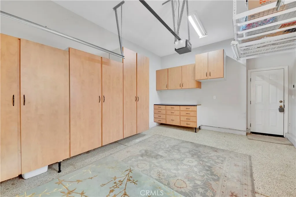 All 3 Garages have built in cabinets, overhead storage, epoxy floors