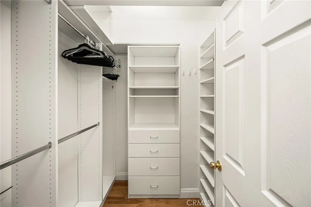 Primary Bedroom's Walk-In Closet with Built-In organizers. Primary Bedroom's Walk-In Closet with Built-In organizers.
