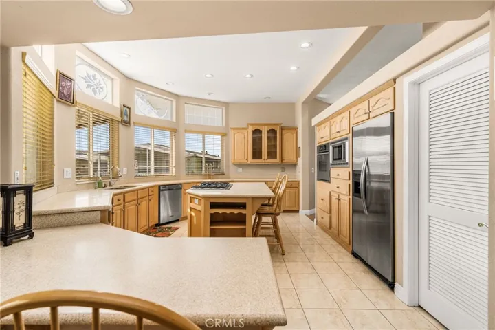 Stainless Steel Refrigerator, Microwave, Oven, and Dishwasher are included.