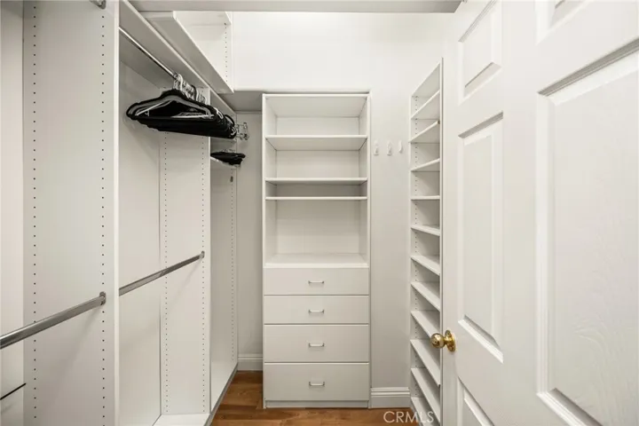 Primary Bedroom's Walk-In Closet with Built-In organizers.