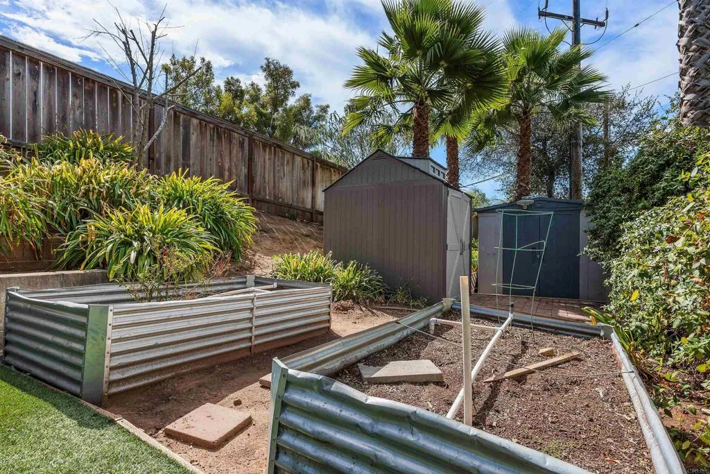 Two sheds and two raised garden beds