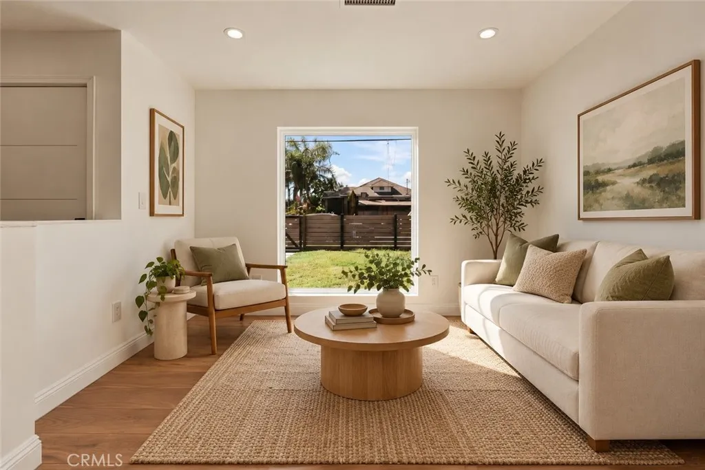 A large picture window brightens the spacious living room. Photo is virtually staged. A large picture window brightens the spacious living room. Photo is virtually staged.