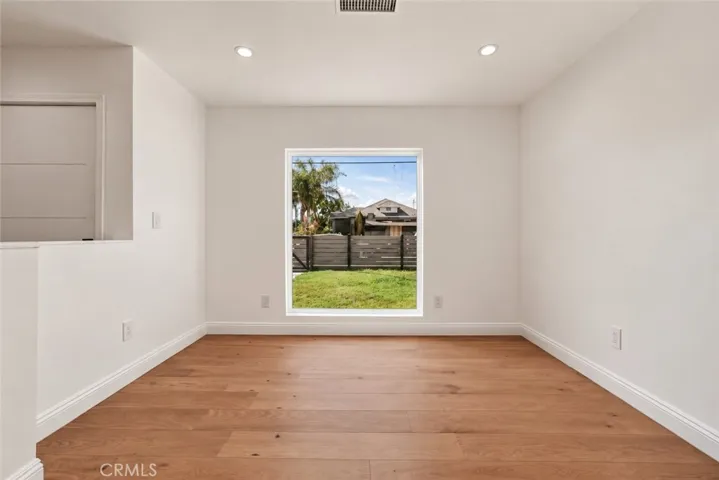 A large picture window brightens the spacious living room.