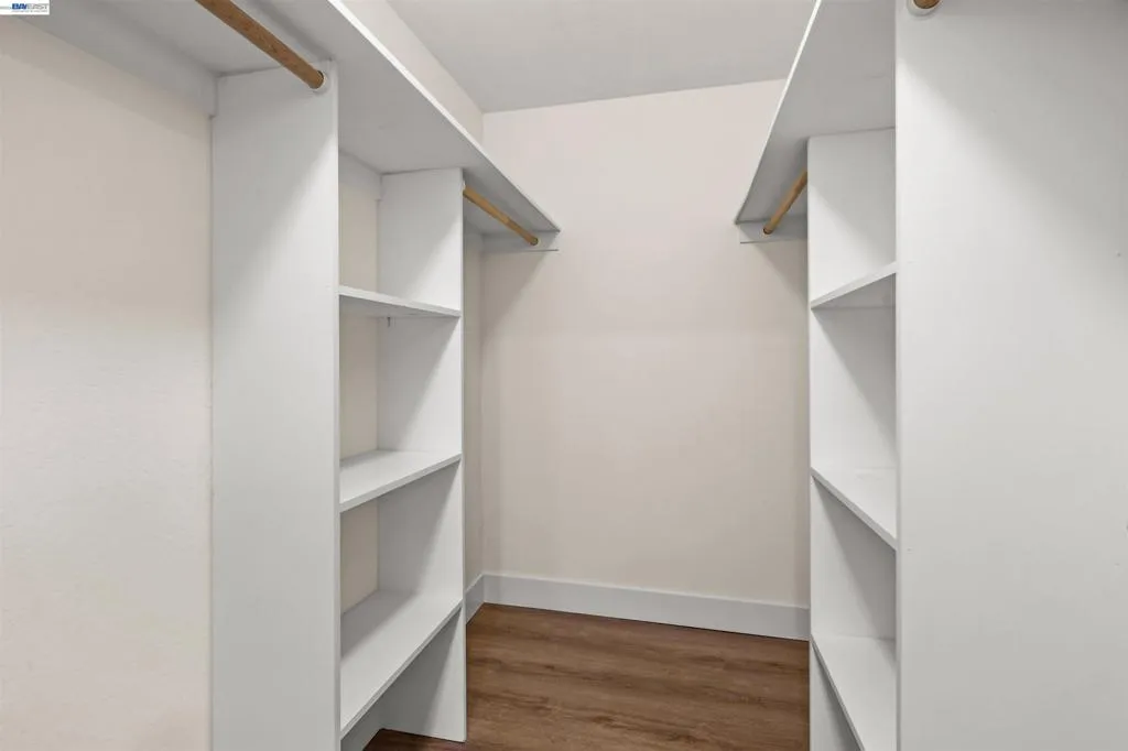Primary Bedroom Walk-In Closet Primary Bedroom Walk-In Closet