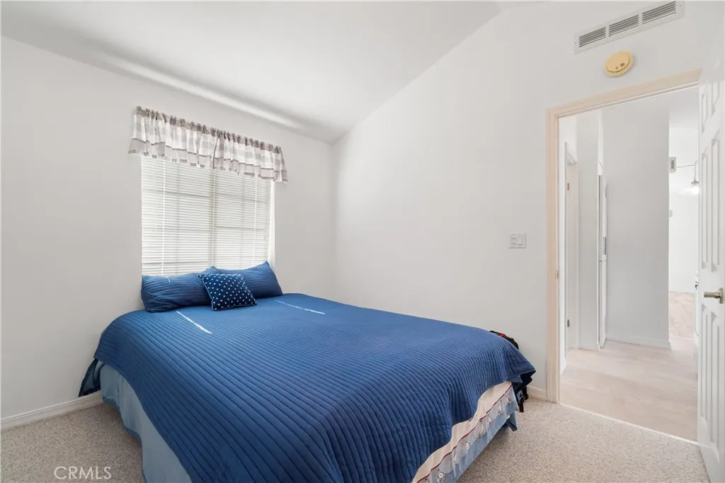 Reverse bedroom view.  Wall to wall Closet is in this room but not showing in the photo.  Closet doors are white.