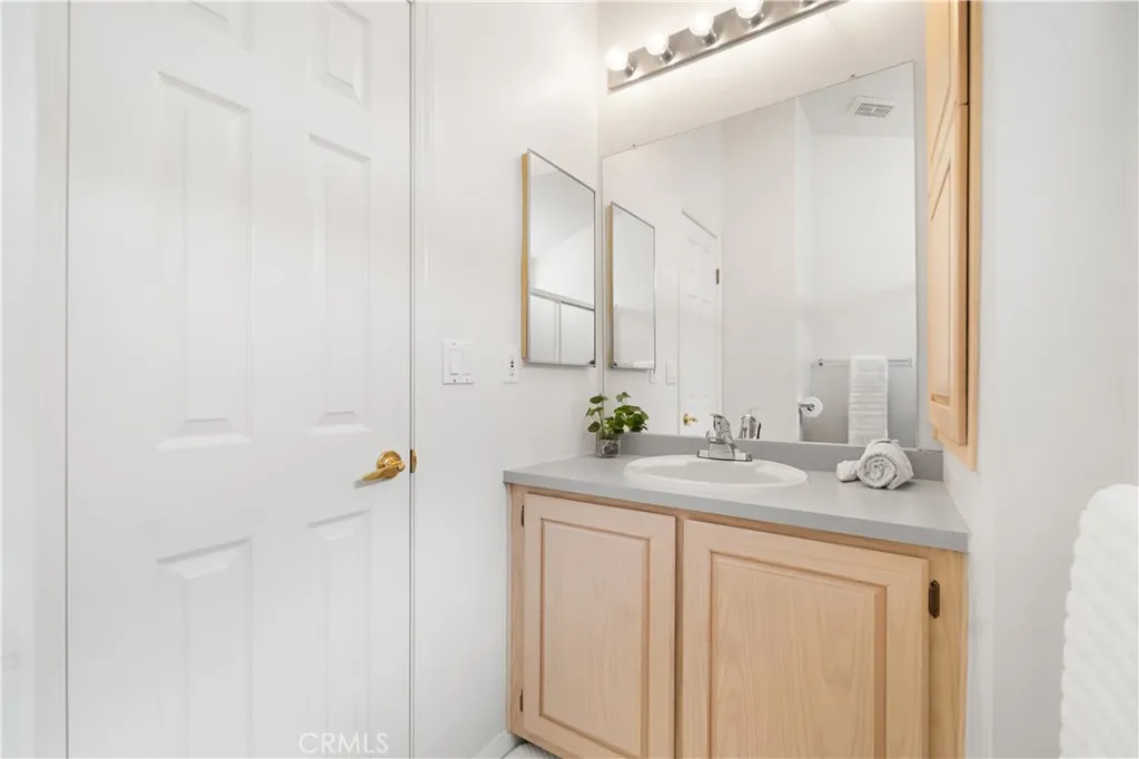 Reverse view of bathroom.  Bathroom has a white toilet not shown in this photo.