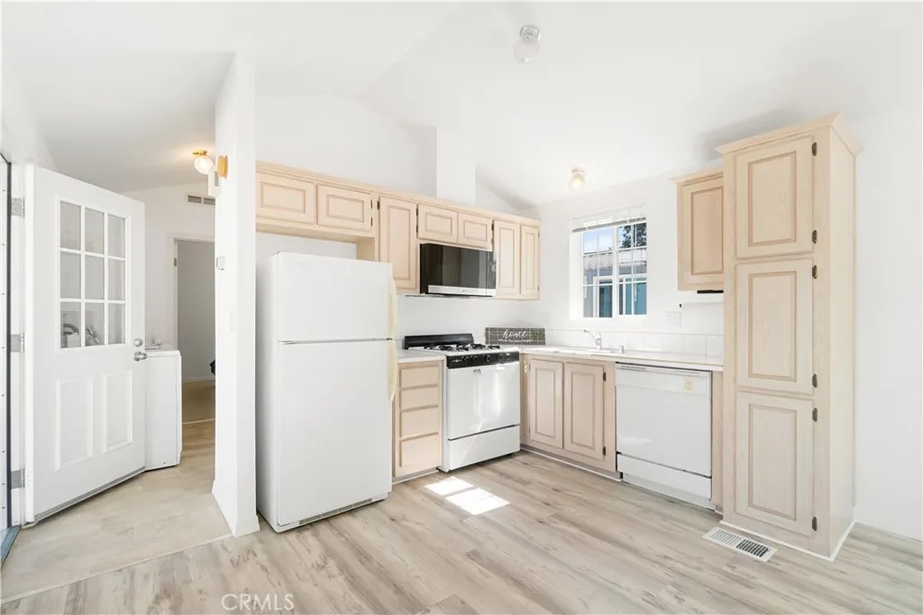 Full kitchen view with back door view