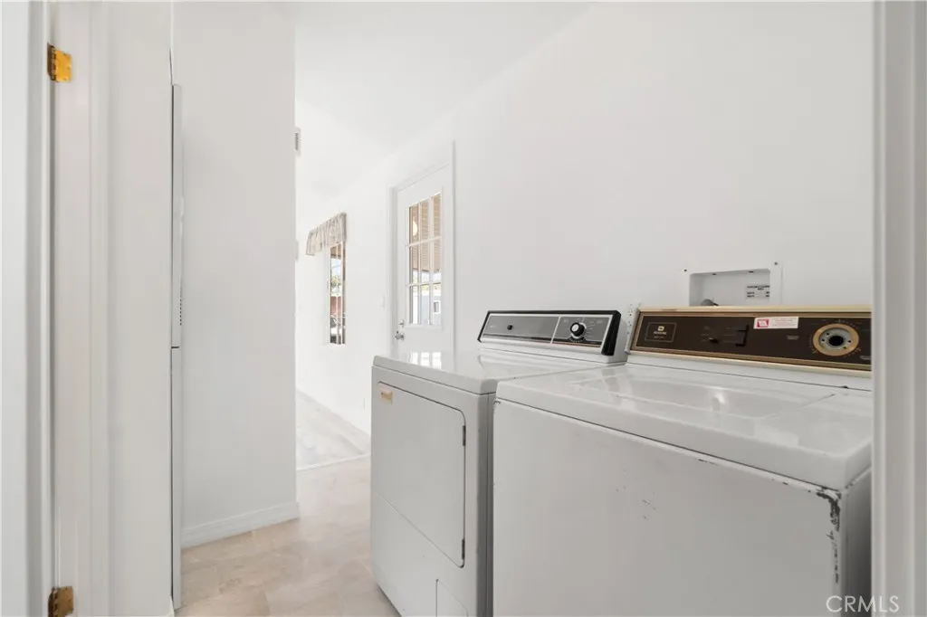 Laundry room set up is in the hallway.  side by side washer/dryer set up.