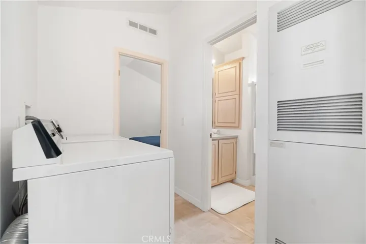 Laundry room in hall.  Side by side hookups.