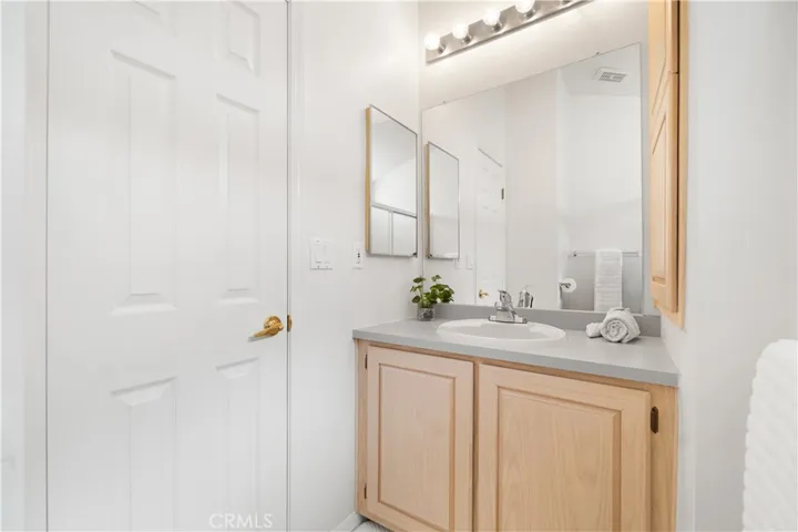Reverse view of bathroom.  Bathroom has a white toilet not shown in this photo.