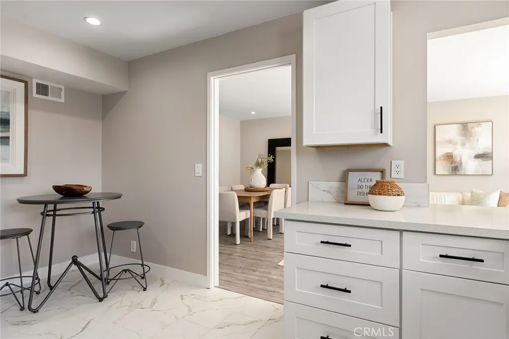 charming breakfast nook, conveniently pass-through to the adjoining dining and living areas charming breakfast nook, conveniently pass-through to the adjoining dining and living areas