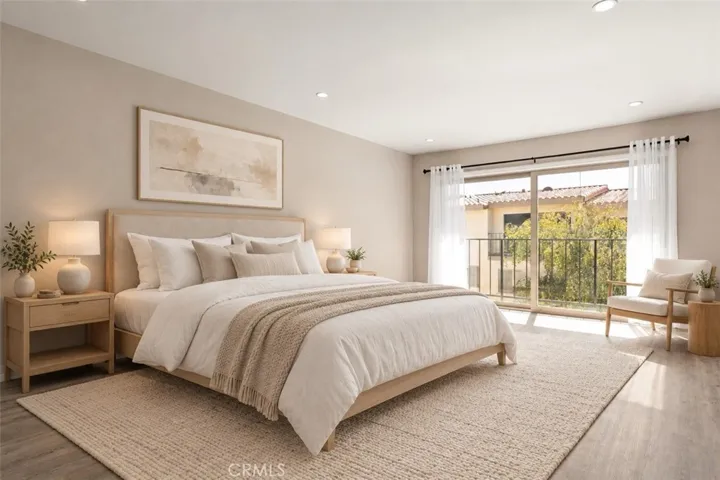 spacious primary bedroom, expansive sliding glass doors open to a private balcony