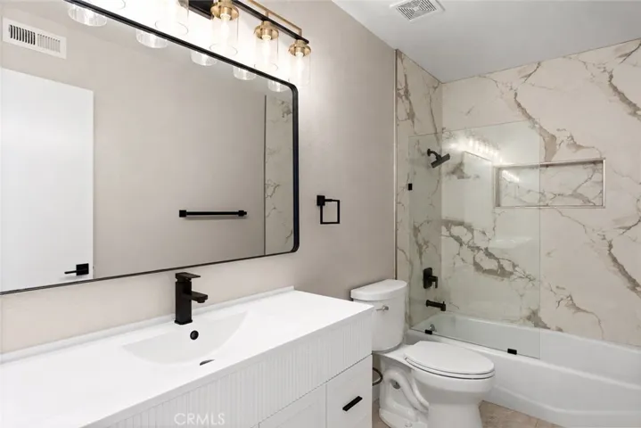 updated and sleek secondary bathroom