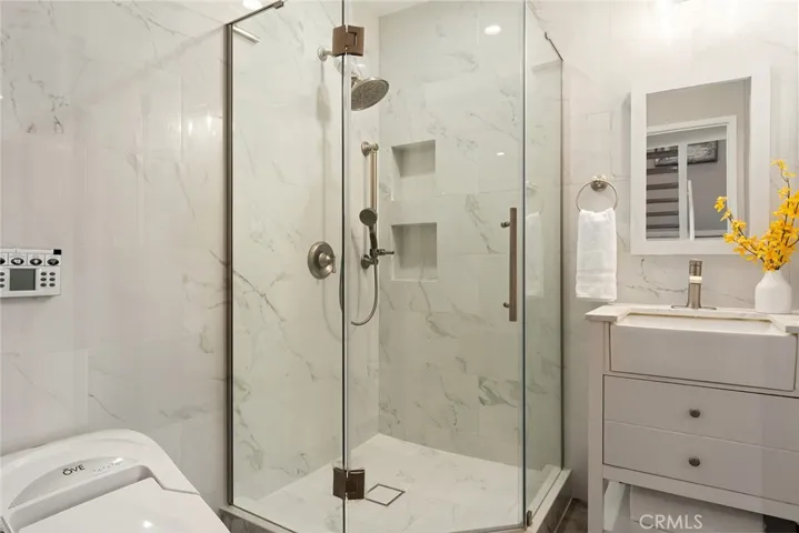 newer bathroom, floor-to-ceiling tiles