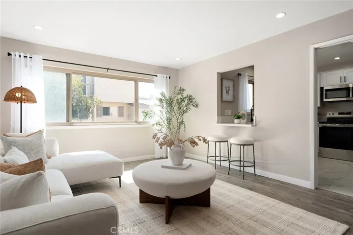 easy access to the newly updated kitchen, a convenient breakfast bar
