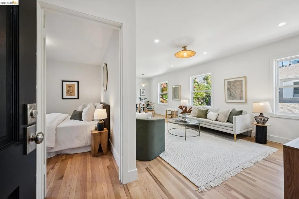 Interior featuring wood-finish flooring, recessed lighting, and multiple windows with sash-style frames