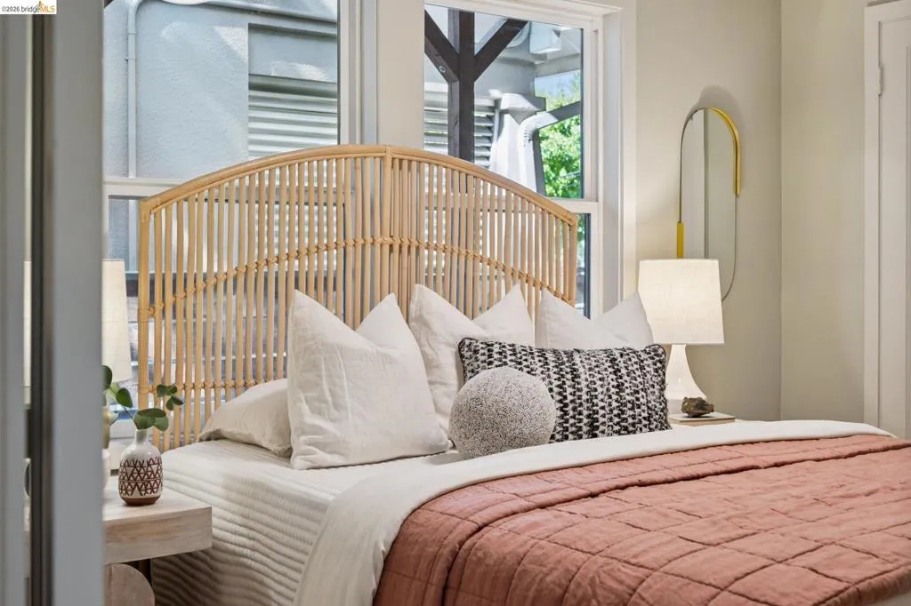 Neutral-toned wall finish featuring double-pane windows with white trim