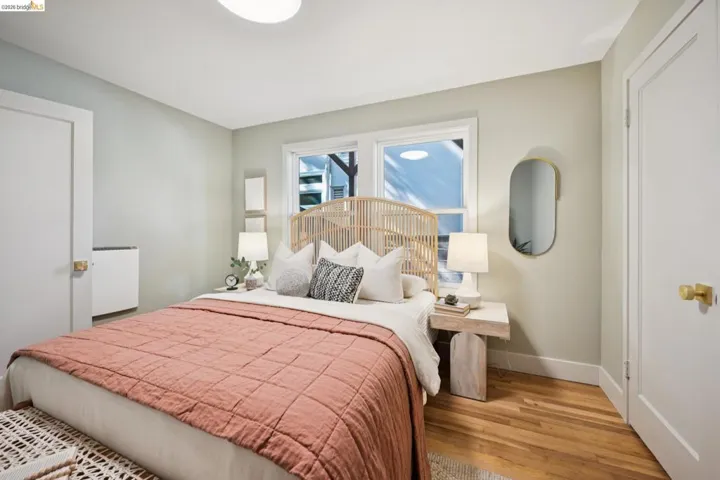 Neutral interior walls, wood-finish flooring, dual-pane windows, and solid-core doors with brass-finish hardware