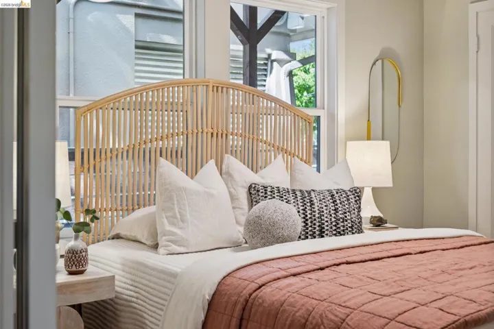 Neutral-toned wall finish featuring double-pane windows with white trim