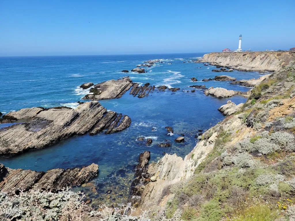 long view of lighthouse shore long view of lighthouse shore