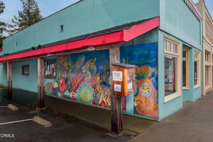 Mural on bldg w Box Of Books