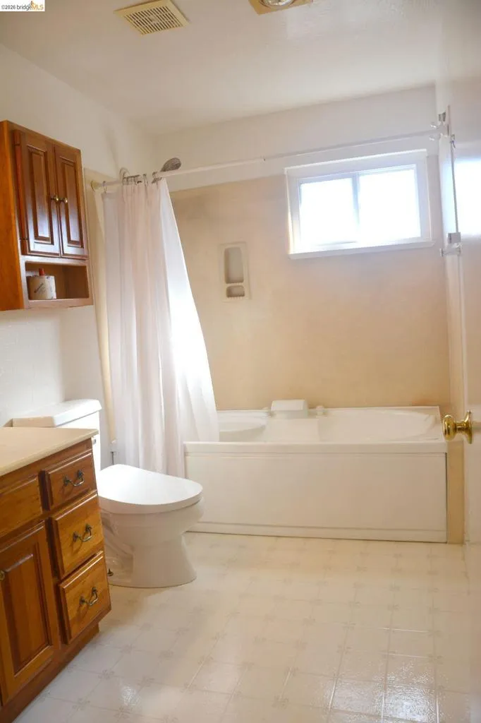 The master bathroom features a Shower over jetted tub and a toilet/bidet.