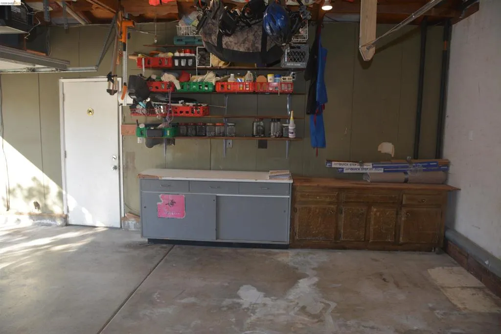 The two car garage features a workbench area