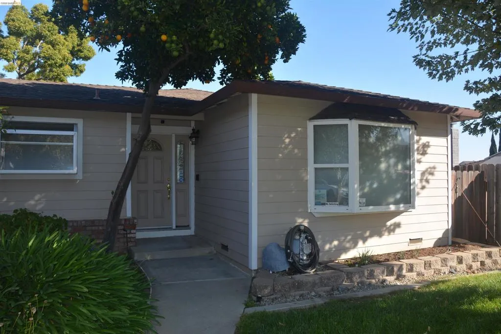 Front view highlighting the living room bay window