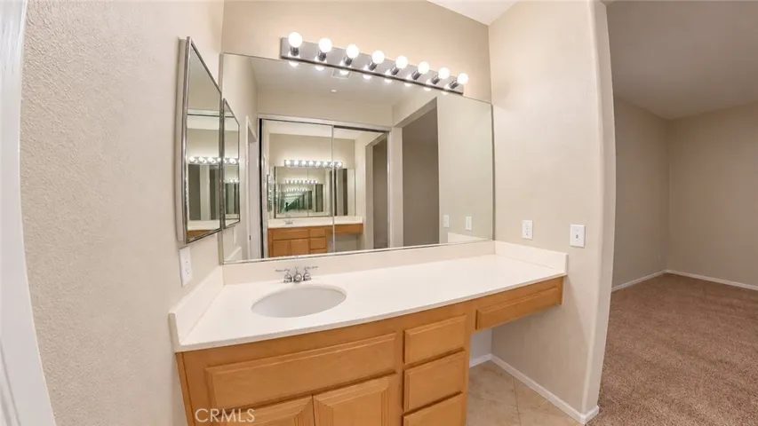first floor bedroom private sink and closet