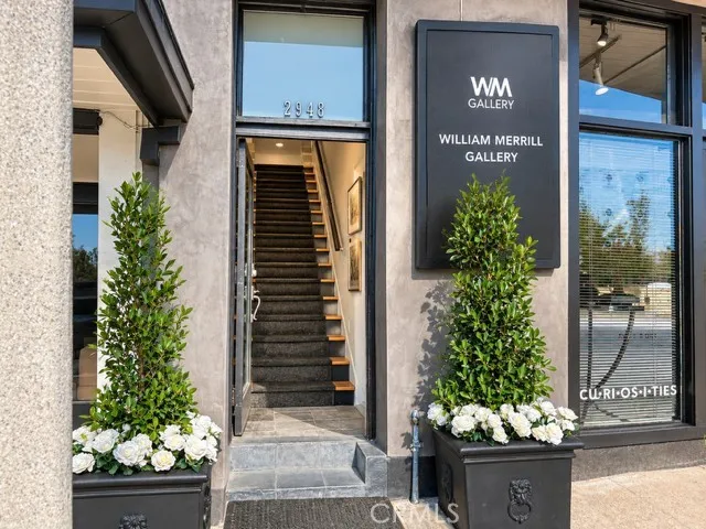 The door to the residence is located next to the gallery.