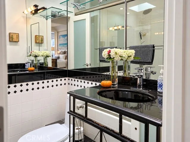 Ensuite bath for primary suite.