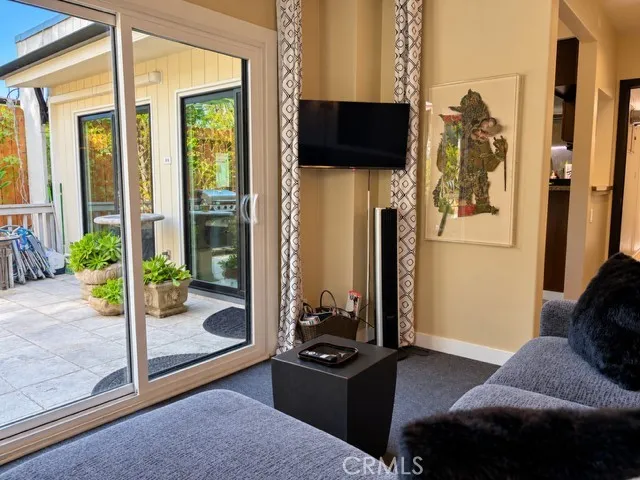 The den features a beautiful view of the garden.