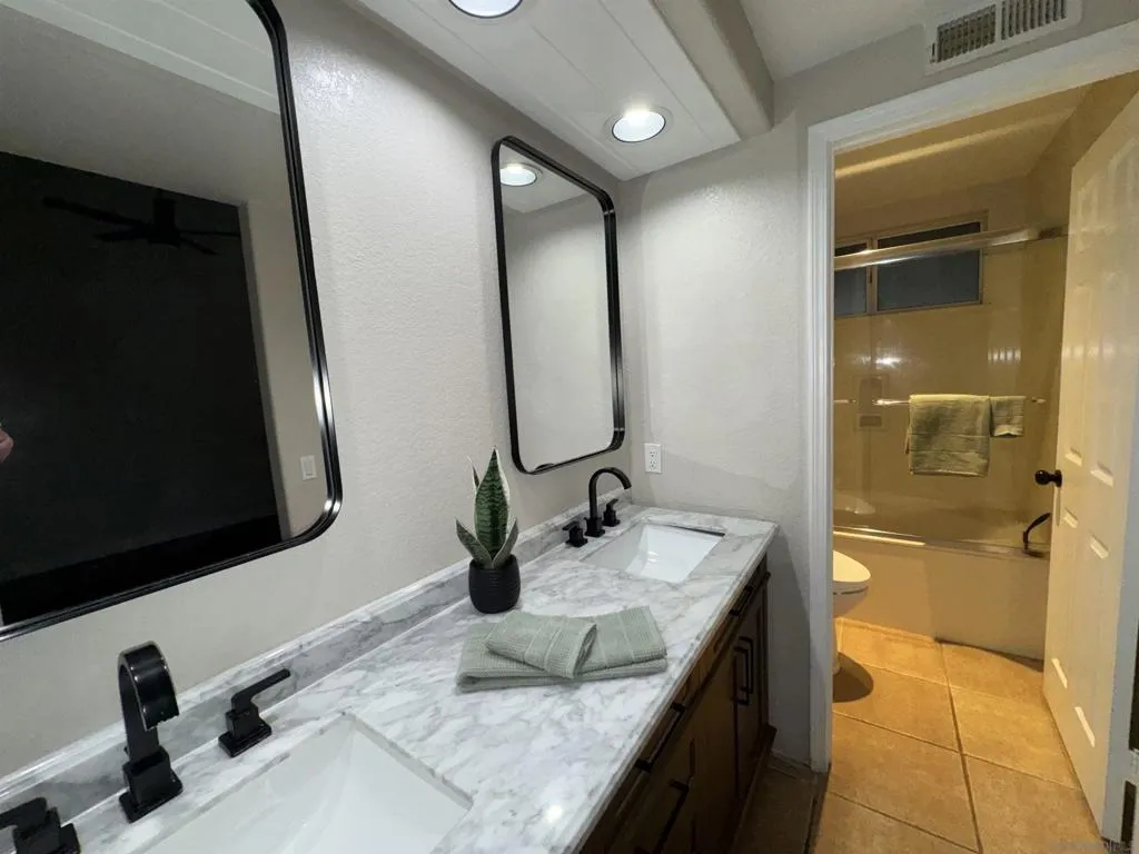Primary bath with a shower/tub combo. Primary bath with a shower/tub combo.
