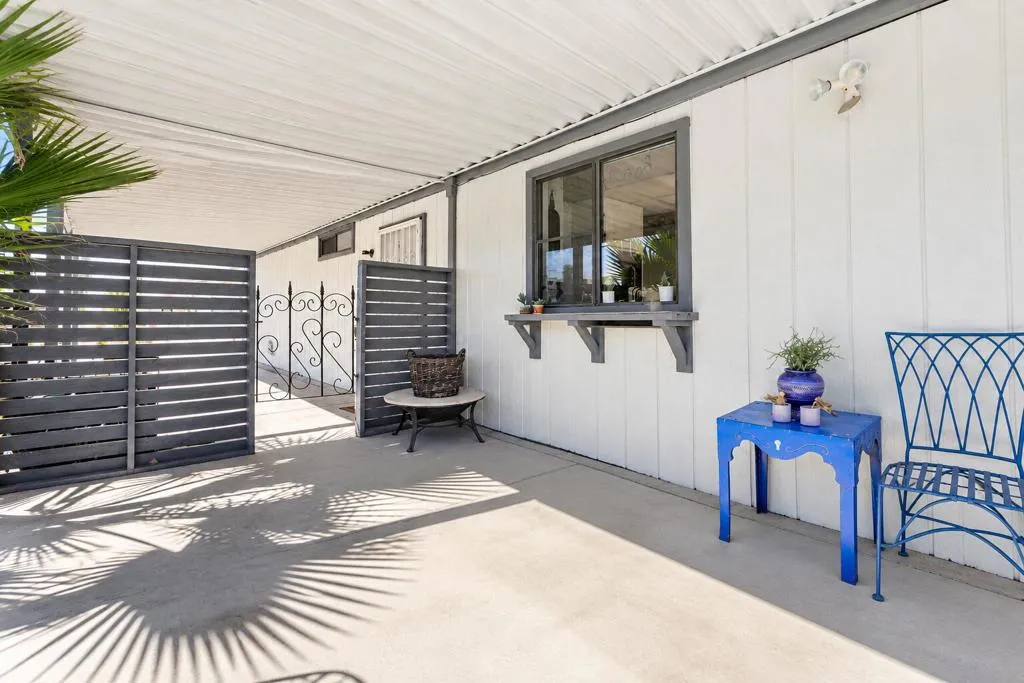 Sunlit Coastal Patio with Blue Accents