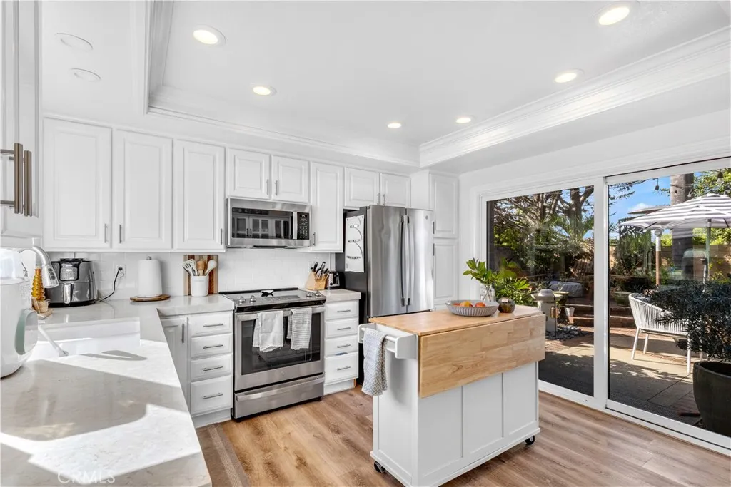 Country kitchen opens to side yard. Country kitchen opens to side yard.