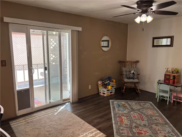 Family room with slider to covered deck