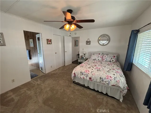 Newer carpet and ceiling fan in Primary