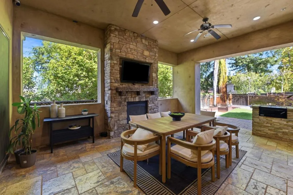 Loggia fireplace wall with TV and outdoor dining, Los Gatos Loggia fireplace wall with TV and outdoor dining, Los Gatos