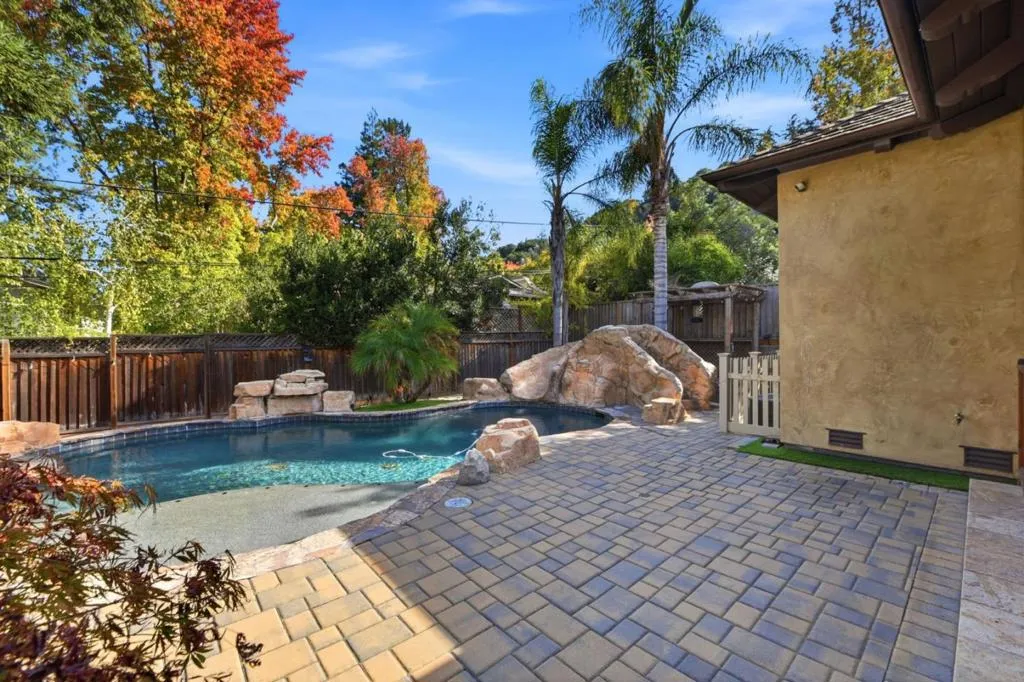 Pool with water slide and natural rock features, Los Gatos Pool with water slide and natural rock features, Los Gatos