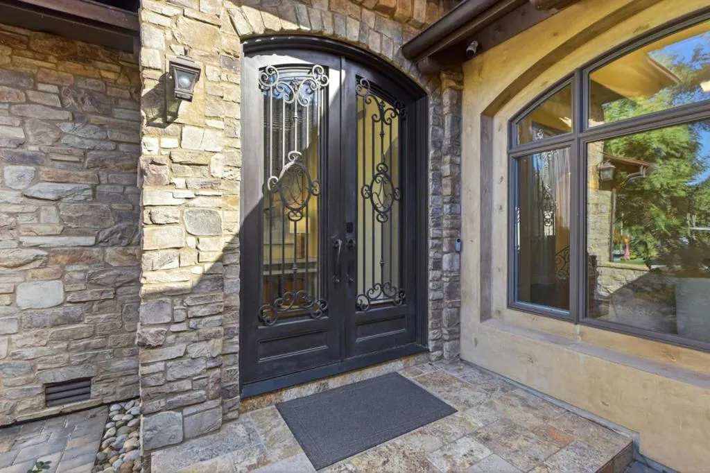 Wrought-iron double entry doors with stone surround, Los Gatos Wrought-iron double entry doors with stone surround, Los Gatos