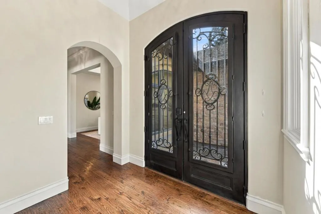 Foyer with arched wrought-iron entry doors and hardwood floors, Los Gatos Foyer with arched wrought-iron entry doors and hardwood floors, Los Gatos