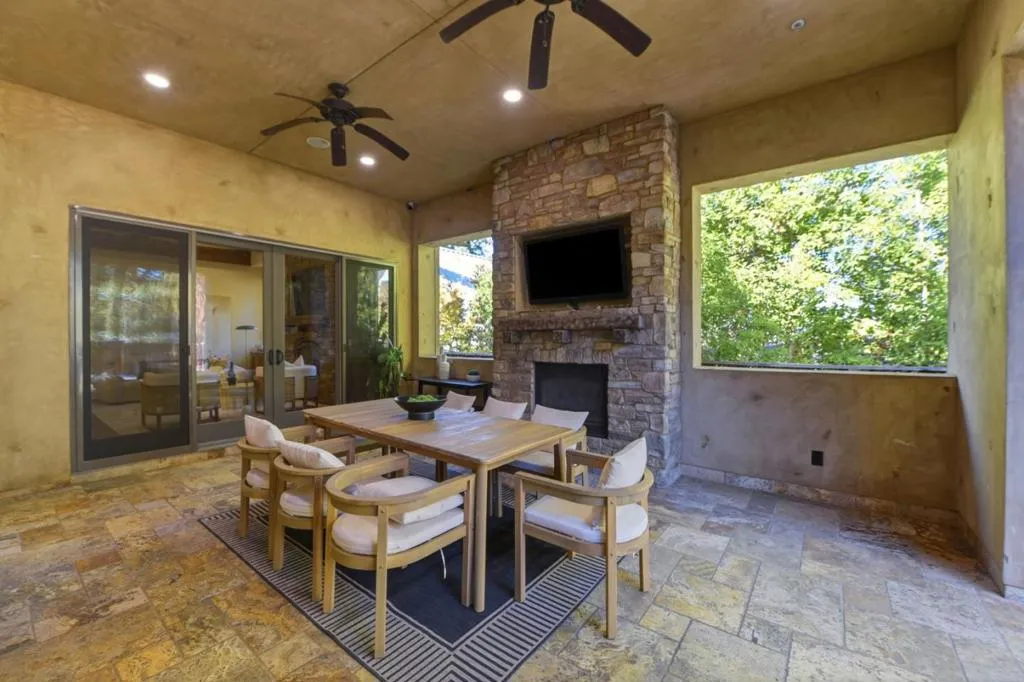 Loggia with stone fireplace, TV and outdoor dining, Los Gatos Loggia with stone fireplace, TV and outdoor dining, Los Gatos