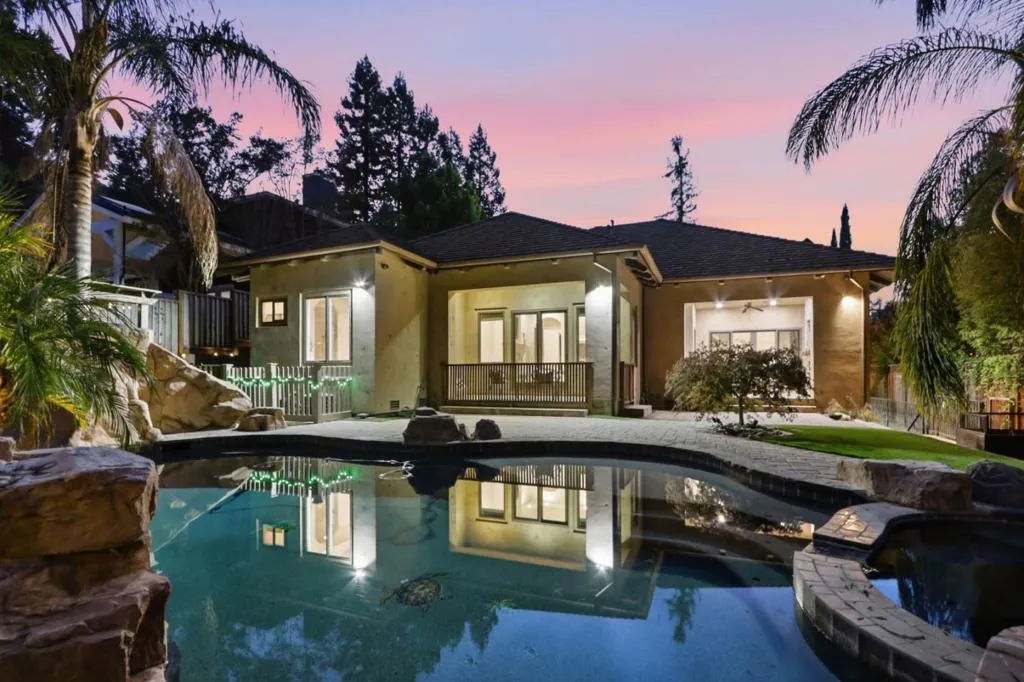 Pool glowing at twilight with rear patio and lawn, Los Gatos Pool glowing at twilight with rear patio and lawn, Los Gatos