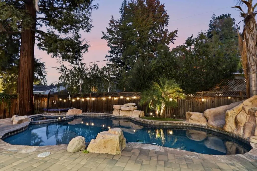 Pool with boulders and landscape lighting at dusk, Los Gatos Pool with boulders and landscape lighting at dusk, Los Gatos