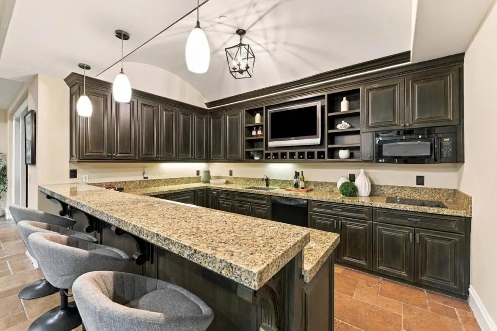 Basement kitchenette with granite bar seating and dark cabinetry, Los Gatos Basement kitchenette with granite bar seating and dark cabinetry, Los Gatos