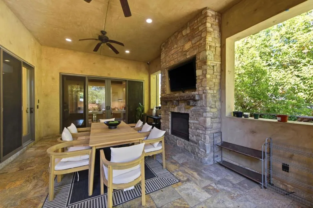 Covered loggia with stone fireplace, TV and outdoor dining, Los Gatos Covered loggia with stone fireplace, TV and outdoor dining, Los Gatos
