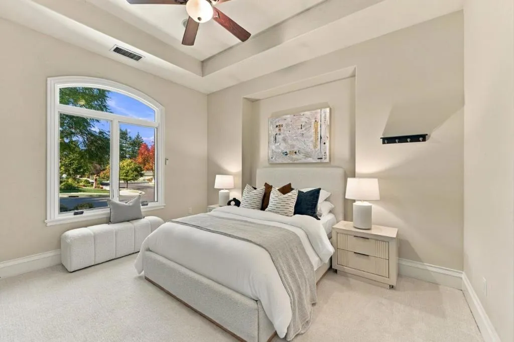 Primary suite bedroom with arched window and plush carpet, Los Gatos Primary suite bedroom with arched window and plush carpet, Los Gatos