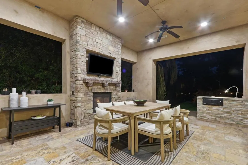Loggia with stone fireplace, TV and outdoor dining table, Los Gatos Loggia with stone fireplace, TV and outdoor dining table, Los Gatos